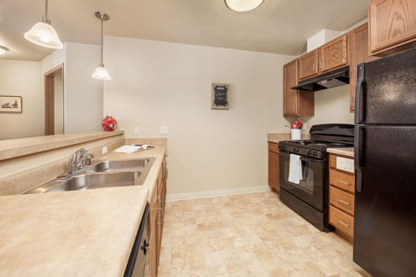 Photo of an apartment's kitchen at Celebre Place Apartments and Assisted Living in Kenosha WI is a place where residents may live independently and stay involved in all life has to offer.