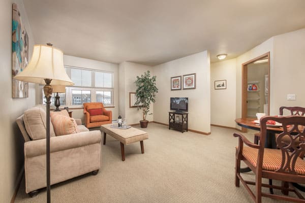 Photo of the living room of an apartment at Celebre Place Apartments and Assisted Living in Kenosha WI is a place where residents may live independently and stay involved in all life has to offer.