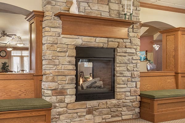 Photo of the fire place in the dining room at Celebre Place Apartments and Assisted Living in Kenosha WI is a place where residents may live independently and stay involved in all life has to offer.