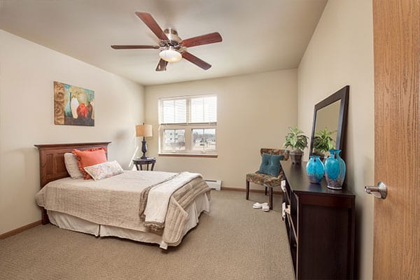 Photo of apartment bedroom area at Celebre Place in Kenosha WI is a place where residents may live independently and stay involved in all life has to offer.